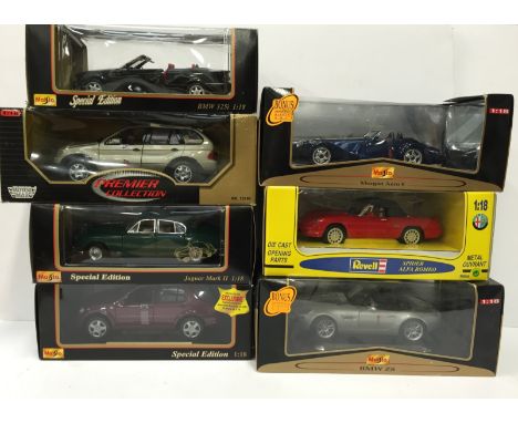 Seven 1/18 scale diecast models by Maisto and others, includes Revell 48838 Spider Alfa Romeo, Maisto Jaguar MkII 1959 and 3 