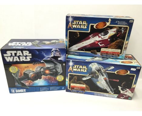 Three Hasbro Star Wars vehicles: Imperial Tie Bomber; Obi-Wan Kenobi Jedi Starfighter; Jango Fett Slave 1. Appear M and boxed