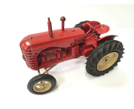 Matchbox early Lesney Toys large scale Massey-Harris Tractor: red body with gold trim, air filter and exhaust stack, beige fr