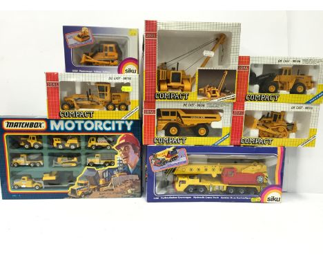 Selection of diecast construction vehicles: Matchbox MC-8 Motorcity Set; Siku 4010 Hydraulic Crane Truck; Siku 2529 Bulldozer