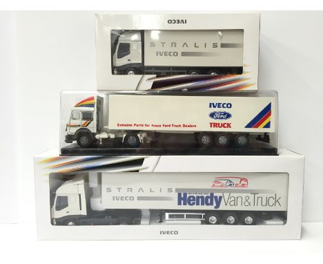 Two Eligor (France) Iveco Stralis 1/43 scale diecast lorry models with wing mirrors, together with another Iveco diecast lorr