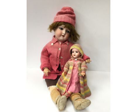 Two Armand Marseille (Germany) bisque head dolls: the first mold '390 A12M', with sleeping blue eyes, eyelashes, wig, open mo