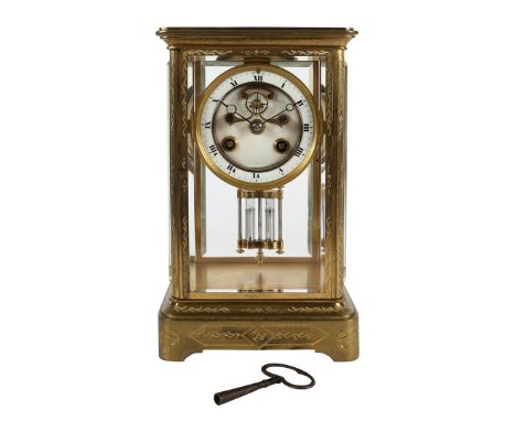 A 19TH CENTURY FRENCH BRASS FOUR GLASS MANTEL CLOCK. late 19th century, the floral engraved case with four bevelled glass pan