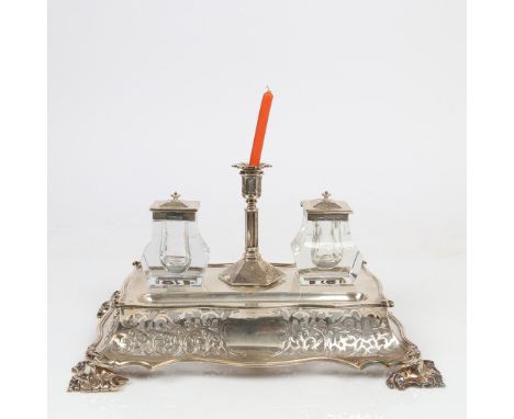 A VICTORIAN SILVER DESK STAND. Sheffield 1849, maker Henry Wilkinson &amp; Co. with central taper stick flanked by two silver