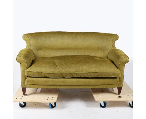 A HOWARD &amp; SONS STYLE UPHOLSTERED WOODSTOCK TWO SEATER SOFA. re-upholstered in a green fabric raised on tapering legs and