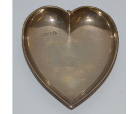 An early 20th century silver heart shaped trinket tray, hallmarked