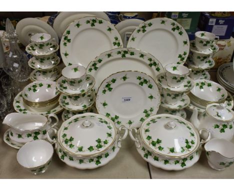 A Colclough Ivy Leaf pattern part dinner and tea service comprising dinner plates, salad plates, side plates, vegetable dishe