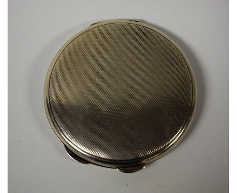 A silver circular engine turned lady's powder compact, integral mirror, Birmingham 1979, 8cm diameter