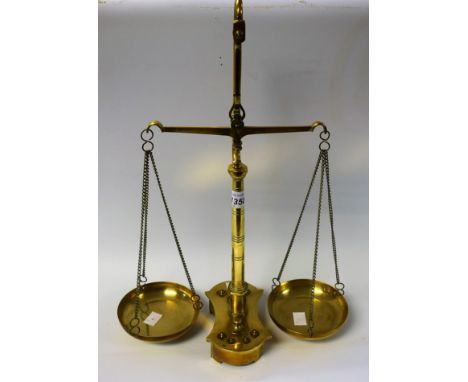 An set of early 20th century brass scales and weights