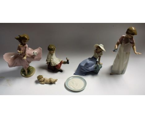 A Lladro figure Girl with Dove; other Lladro and Nao Spanish porcelain figures and a small pin dish (6)