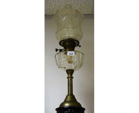 A Victorian brass oil lamp, with etched glass shade