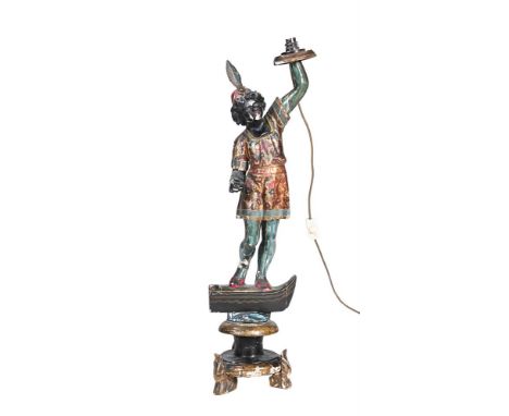 A VENETIAN PAINTED FIGURAL STANDARD LAMP Modelled as a standing blackamoor holding a torch stood on the prow of a gondola  85