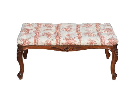 A VICTORIAN CARVED WALNUT CENTRE STOOL  MID 19TH CENTURY Carved to all sides, the button upholstery fabric printed with colum
