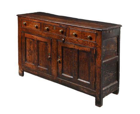 A GEORGE III OAK WELSH DRESSER  PROBABLY NORTH WALES, MID 18TH CENTURY With arrangement of three drawers and two cupboard doo