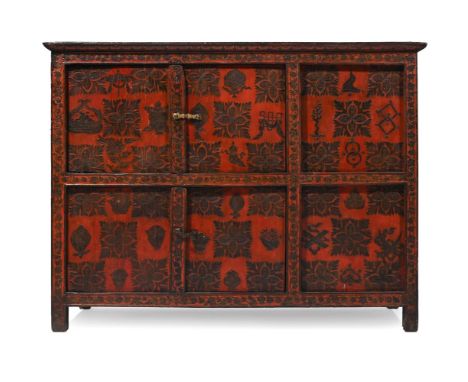 A CINNABAR LACQUERED SIDE CABINET  With two pairs of cupboard doors enclosing a compartment interior  86cm high, 113 wide, 46