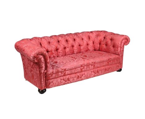 A MAHOGANY AND RED DAMASK BUTTON UPHOLSTERED  SOFA  LATE 19TH CENTURY Of 'Chesterfield' type  With bun feet to the front 71cm