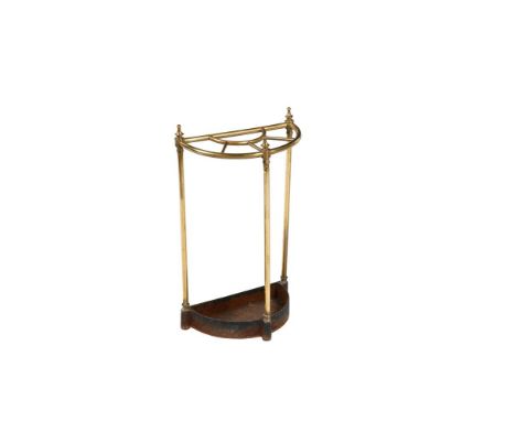 A BRASS AND CAST IRON STICK STAND  CIRCA 1900 Of semi-elliptical outline  64cm high, 38cm wide, 21cm deep 