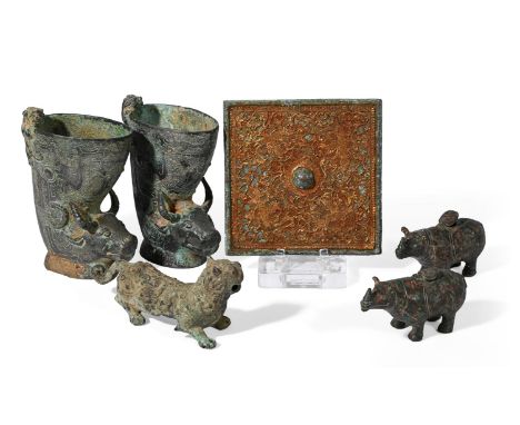 A PAIR OF CHINESE ARCHAISTIC MODELS OF RHINOS 20TH CENTURY Inlaid with wire, hinged covers to backs for inserting incense, 15