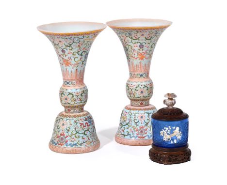 A PAIR OF CHINESE ENAMEL GLASS VASES 20TH CENTURY With flared necks and painted in colours with scrolling stems and flower he