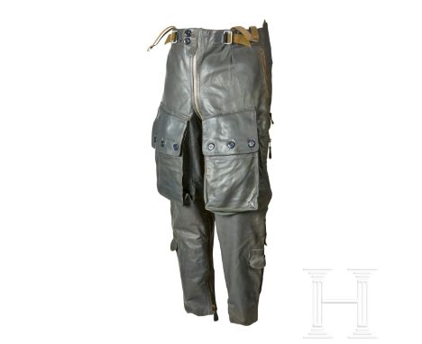 A Pair of Heated Leather Trousers for Aviation PersonnelElectrically heated grey smooth leather trousers, three-button thigh 