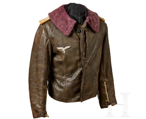 A Leather Jacket for Fighter Pilots Brown leather jacket with bluish-purple fur collar. Front covered fly with blue plastic b