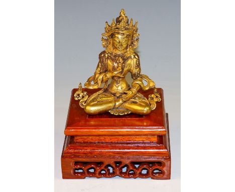 Vajrasattva Tibet Bronze, vergoldet. H. 12,5 cm (Ghanta fehlt.). Dazu: durchbrochener Holzsockel. (61215)