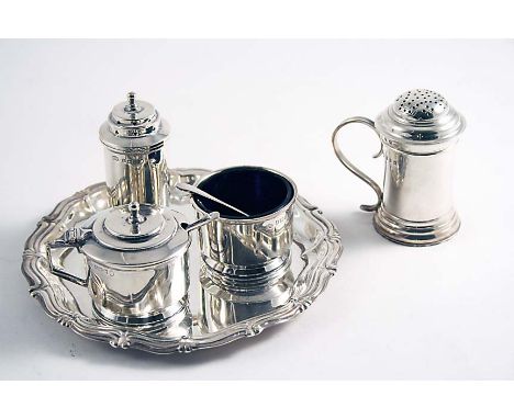 A MIXED LOT:- An Art Deco three-piece condiment set by Elkington & Co., Birmingham 1935 (with blue glass liners & two spoons)