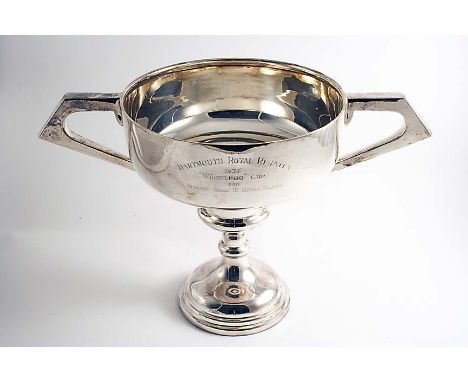 AN ART DECO TROPHY CUP with two angular handles and a knopped pedestal base, inscribed "DARTMOOR ROYAL REGATTA 1934 WHITELEGG