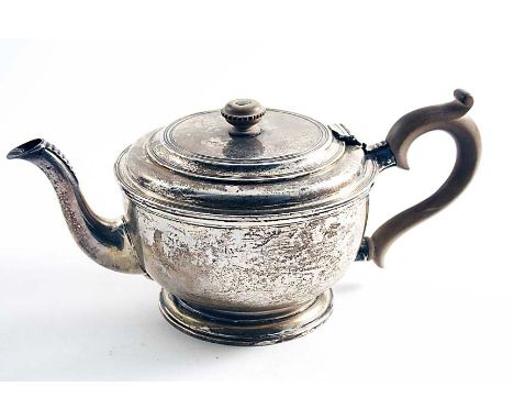 A MID 20TH CENTURY TEA POT Circular with borders of incised reeding, a wooden scroll handle & a knop finial, by Richard Comyn