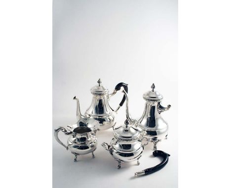 A LATE 20TH CENTURY EGYPTIAN FOUR-PIECE TEA &amp; COFFEE SERVICE with squat circular bodies, waisted necks and four feet, the