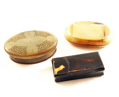 AN 18TH CENTURY OVAL HORN SNUFF BOX with punched decoration on the cover and two other 19th century horn snuff boxes;  the la