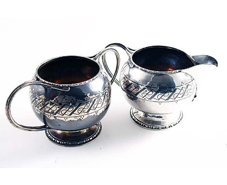 A 20TH CENTURY HAND-MADE CREAM JUG & MATCHING SUGAR BOWL with a niellowork frieze around the bodies, bifurcated loop handles 