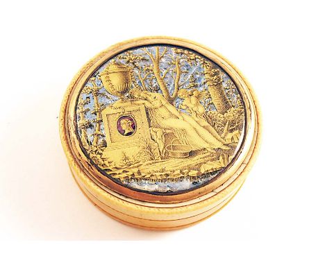 A LATE 18TH / EARLY 19TH CENTURY CIRCULAR IVORY SNUFF BOX with a tortoiseshell lining, the cover inset with a verre elgomise 