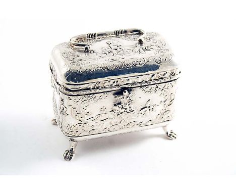 A DECORATIVE CONTINENTAL TEA CADDY on four feet with a rounded oblong body and a swing handle, English import-marked Chester 