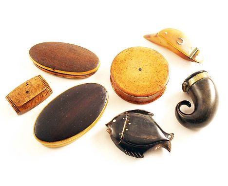 A MIXED LOT:- Two navette-shaped wood/horn snuff boxes, a horn snuff box shaped like a fish, a hoof snuff with an inlaid hors