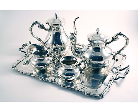 A 20TH CENTURY PERUVIAN FOUR-PIECE TEA & COFFEE SERVICE and two-handled tray of shaped rectangular outline, maker's mark "IND