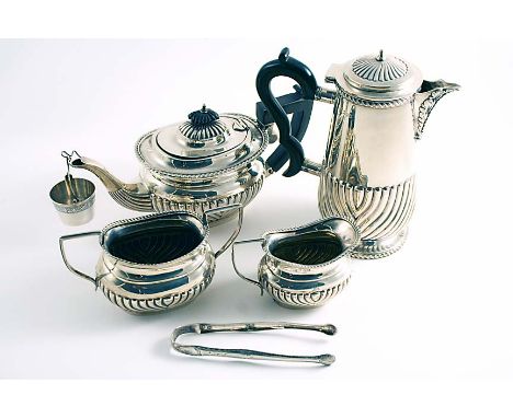 AN EARLY 20TH CENTURY THREE-PIECE TEA SET with part-fluted, rounded oblong bodies, initialled "K", by W.H. Sparrow, Birmingha