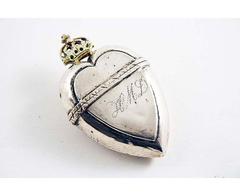 A LATE 18TH CENTURY NORWEGIAN PARCELGILT HOVEDVANSAEG heart-shaped with a crown finial, pricked "HMD" on the front, gilt inte