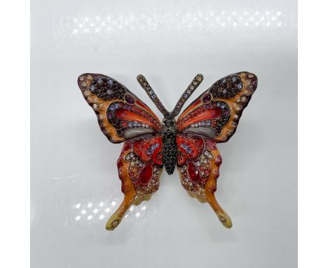 Vibrant red, orange and yellow enamel inlay cover the wings on this beautiful butterfly. Swarovski crystals in deep jewel ton