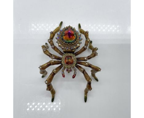 Fabulous jeweled and enamel spider figurine with a surprise. A clock is revealed when you lift the large faceted Swarovski cr
