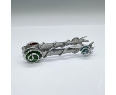 An unique serving utensil with debossed dimples on the grips. Adorned with coiling steel over emerald-green, aquamarine-blue,