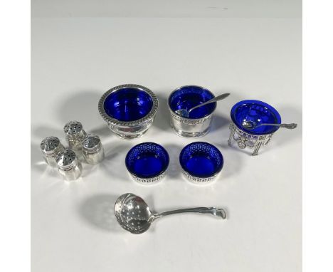 5 sterling silver small salt cellars with a cobalt glass interior. 4 mini shakers. 1 tiny slotted ladle, and 2 tiny spoons. W