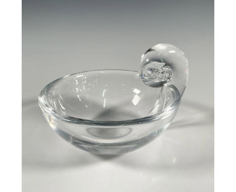 Mid century clear glass crystal bowl with a fluid scroll handle, known as the Snail handle. Steuben etched backstamp. Dimensi