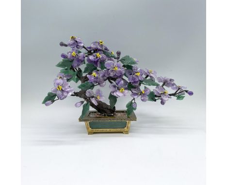 A beautiful handcrafted tree with amethyst flowers and jade leaves. Placed in a green and brass flower pot-formed base. Dimen