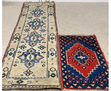 TWO RUGS - Eastern woollen carpet runner, blue and cream, 363 x 99cms together with a smaller rug, navy and red, 155 x 81cms