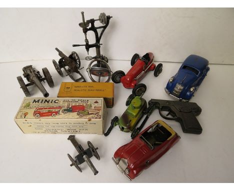 A collection of vintage tin plated toys to include a Schuco racing car and Minic boxed model
