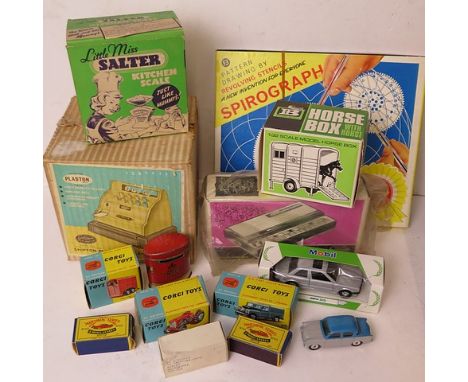 A collection of vintage toys to include boxed Corgi and Matchbox model cars, a boxed cash till and other items