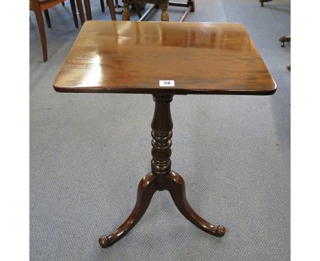 A 19th century mahogany tea table on turned column and splayed legs