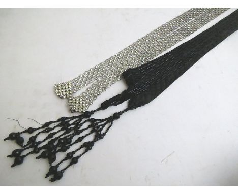 An Edwardian black jet bead and tassel opera length neck tie, together with a 1930s white paste belt
