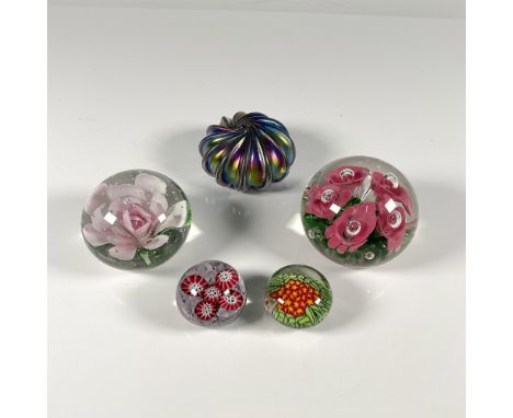 An assortment of abstract polychrome spheres. A pink floral one made by Bart Zimmerman in 2004. An iridescent swirl created b